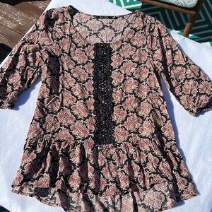 Doe & Rae womens top with lace accent on front.